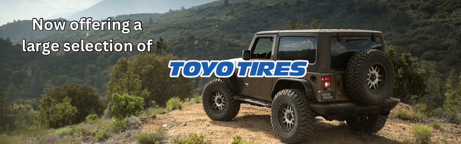 Image of a Jeep Wrangler overlooking view from the top of a mountain with Toyo Tires Open Country A/T tires